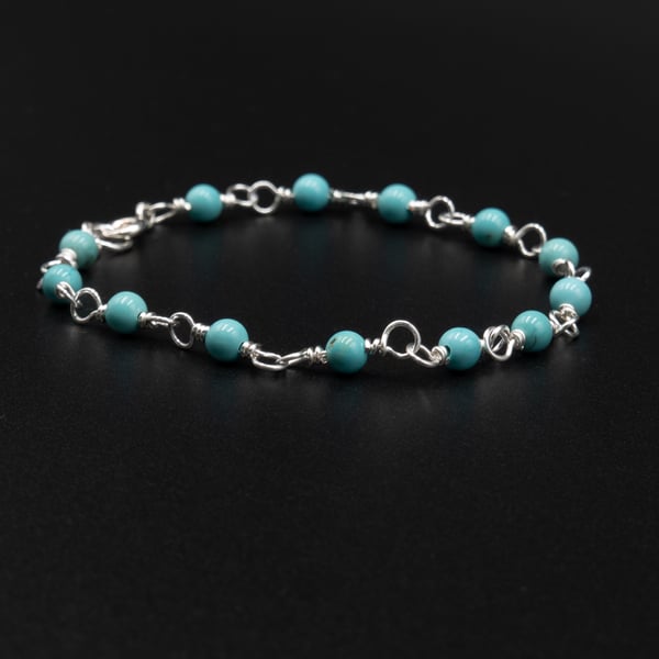Turquoise blue Howlite and silver handmade link bracelet.