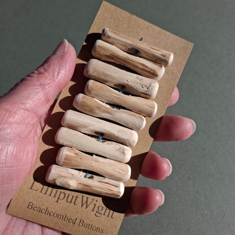 Set of nine driftwood toggle buttons with single hole