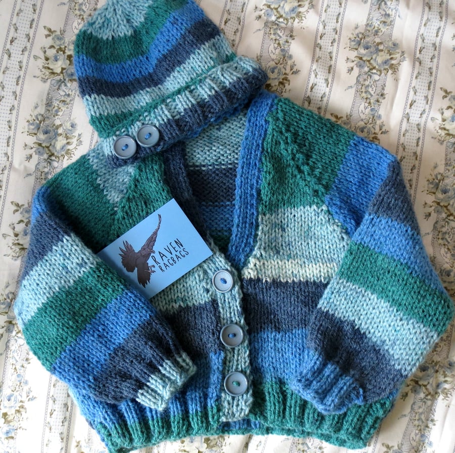 Blue stripey hand knitted baby cardigan and matching beanie hat