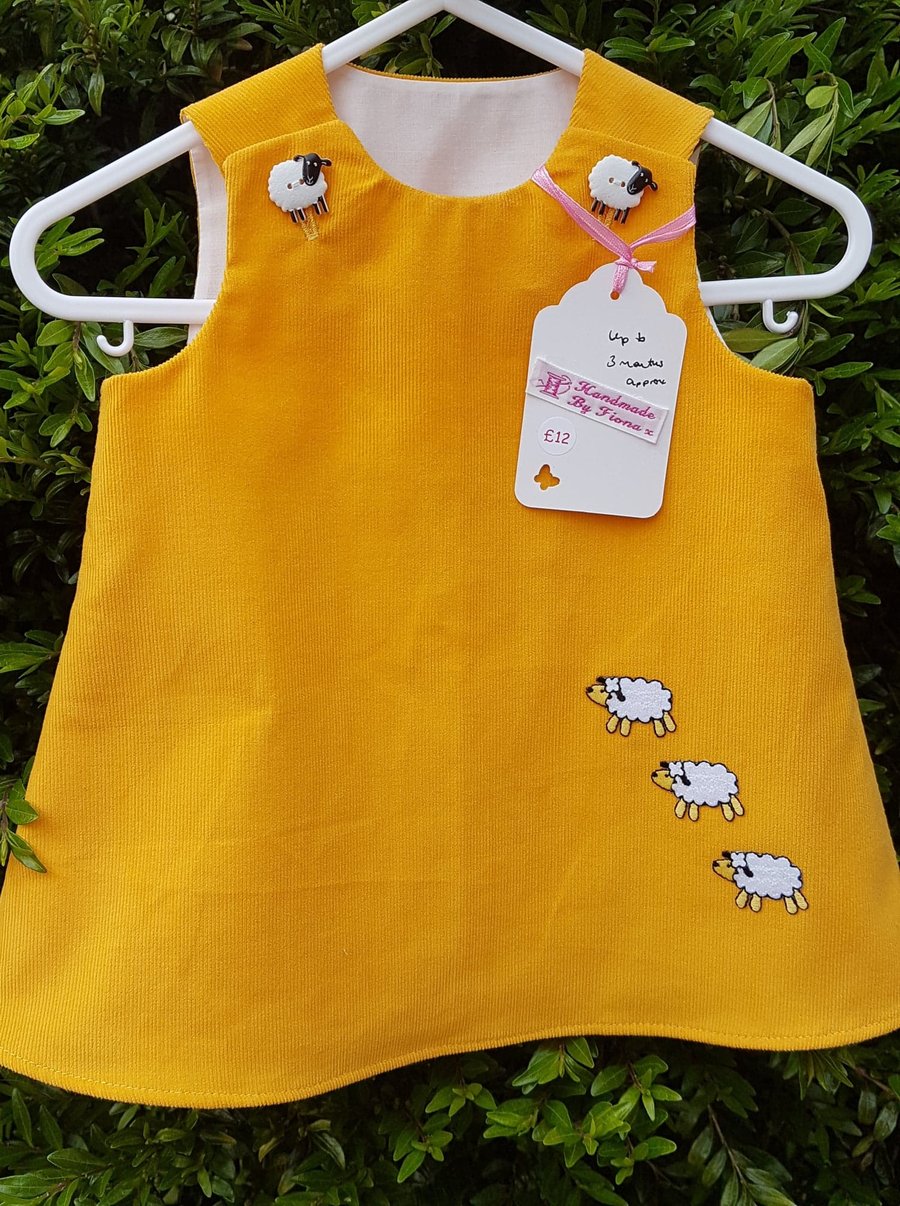 Age: 0-3m. Yellow baby needlecord pinafore dress. 