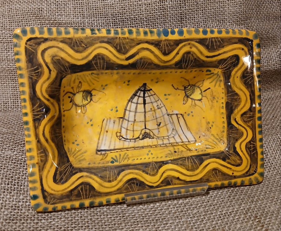 Square slip ware dish with hand painted bee skep