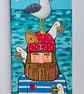 Handpainted canvas of a cornish fisherman with a cornish seagull on its head.