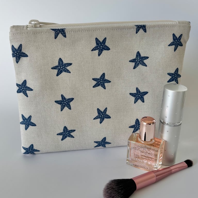 Large flat cotton zipped pouch, purse, make up bag in beige with navy starfish