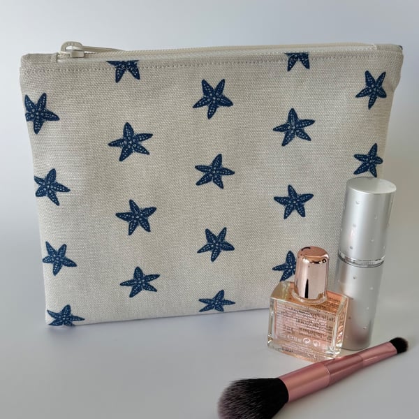Large flat cotton zipped pouch, purse, make up bag in beige with navy starfish
