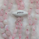 Rose quartz and jade knotted cord necklace with peace ceramic focal bead