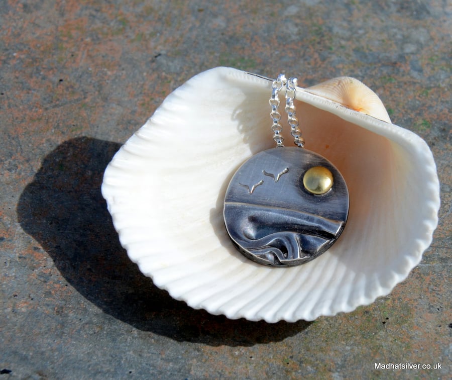 Silver beach, sea pendant, with brass sun and seagulls
