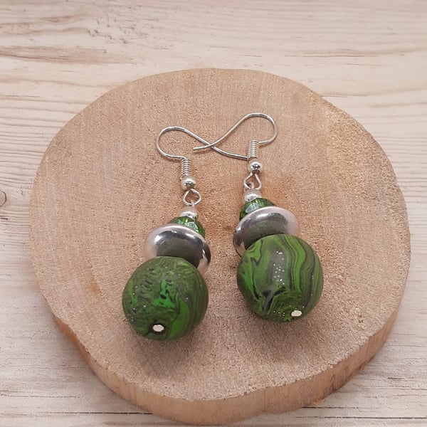 Green, black and silver dangly earrings