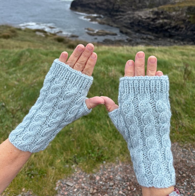 Hand knitted fingerless gloves in cable knit pattern