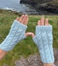 Hand knitted fingerless gloves in cable knit pattern