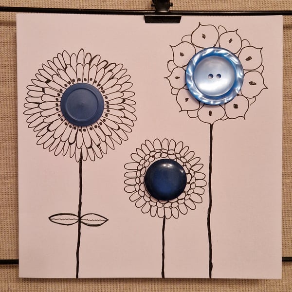 Handmade card with 3 blue flowers using big buttons & hand drawn petals stems