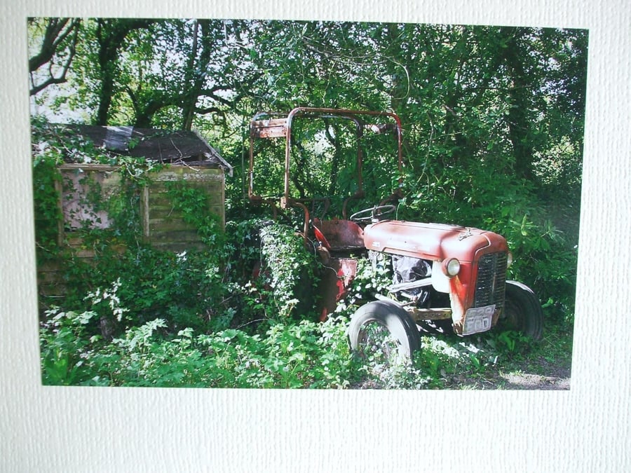 Photographic card of an old tractor.