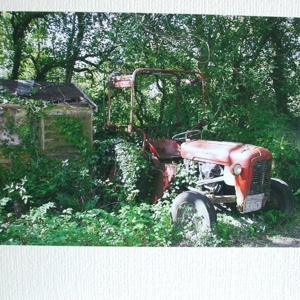 Photographic card of an old tractor.