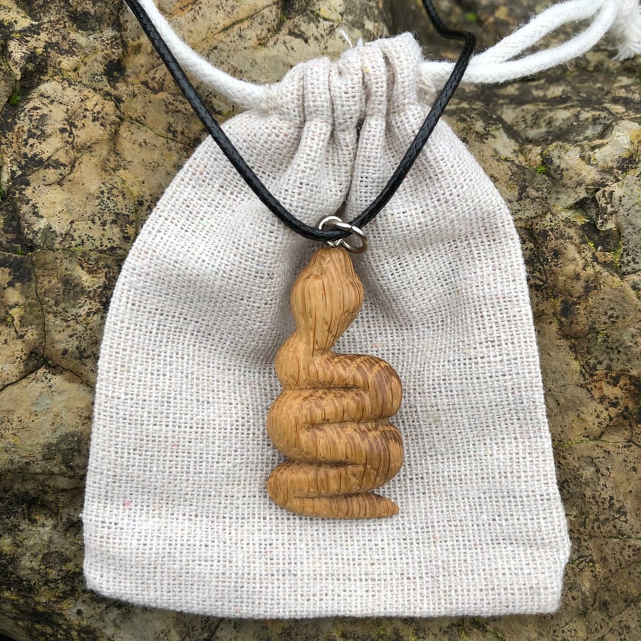 Hand carved oak wood snake pendant