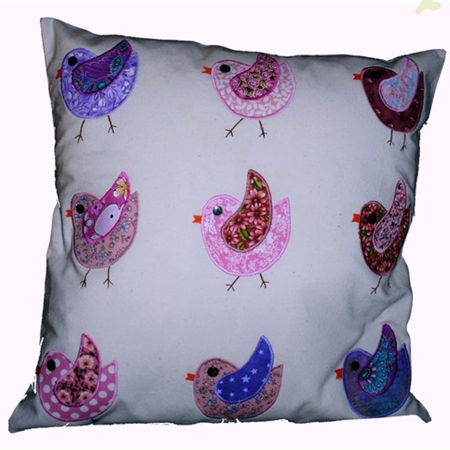 Appliqued cushion with birds