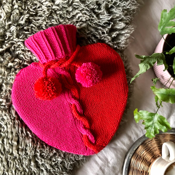 Heart shaped hot water bottle with hand knit cover
