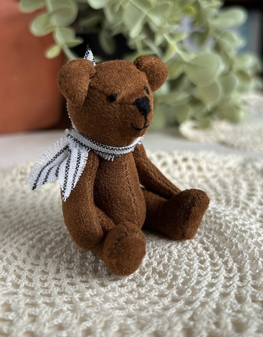 Mini teddy bear companion for emotional support, nostalgic memorabilia  