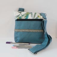 Fabric crossbody bag with zipped pocket on front