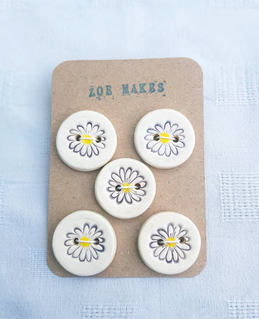 Pretty daisy ceramic buttons handmade and hand painted. 