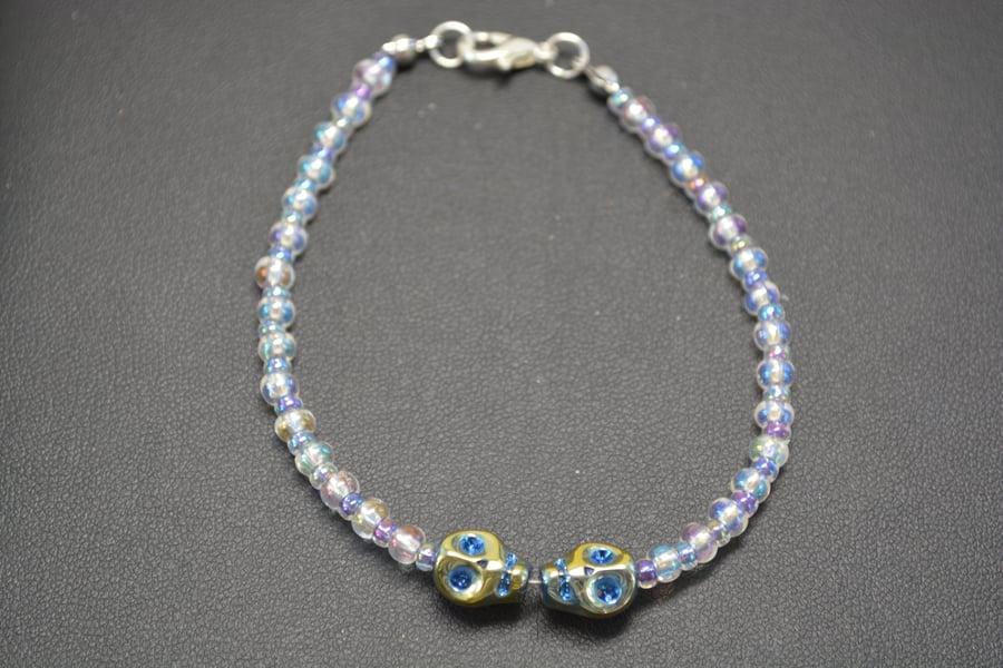 Blue metallic double skull bracelet