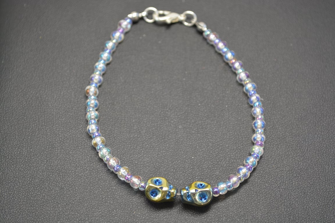 Blue metallic double skull bracelet
