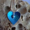 Blue and turquoise heart with flowers