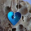 Blue and turquoise heart with flowers