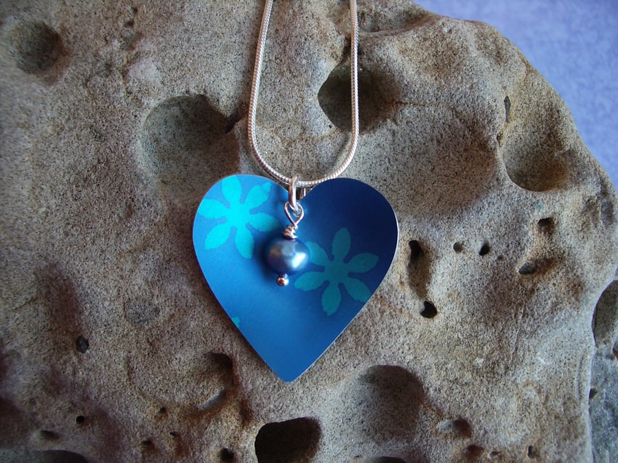 Blue and turquoise heart with flowers