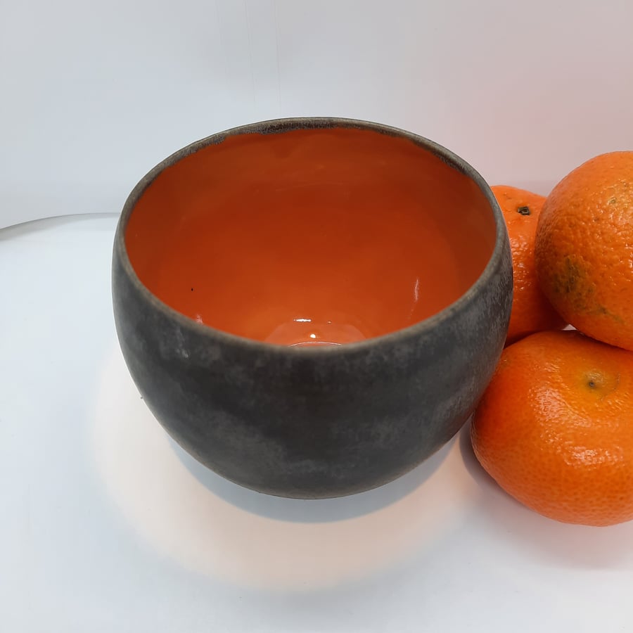 Small burnt orange ceramic bowl