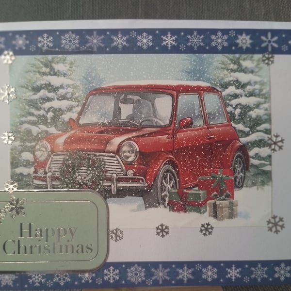 old mini car broken down in the snow