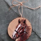 Horse portrait on hanging wooden log decoration