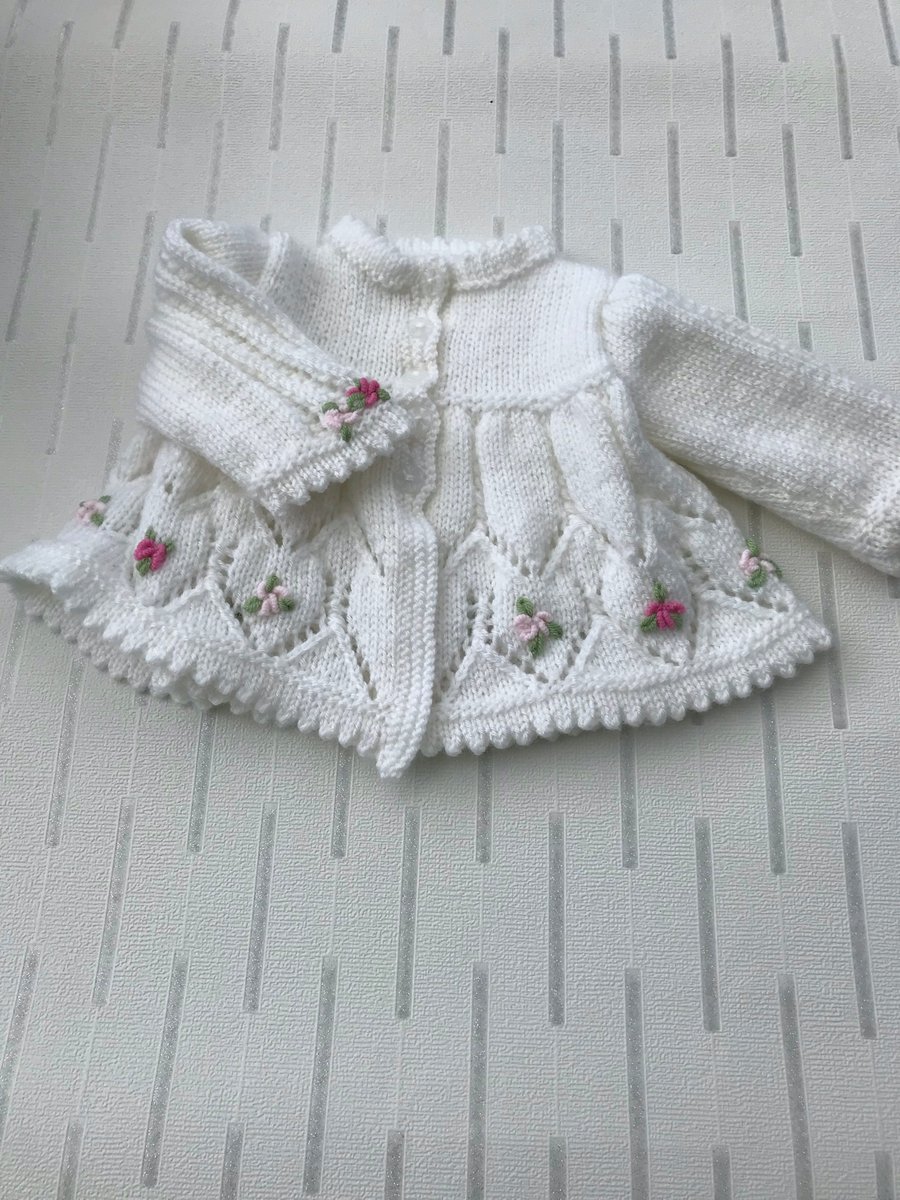 Pretty matinee jacket with embroidered flowers