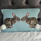 Handmade linen cushion with applique printed rabbit design & fluffy pompom tails