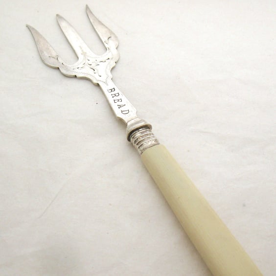 Vintage bread fork, celluloid handle, hand stamped