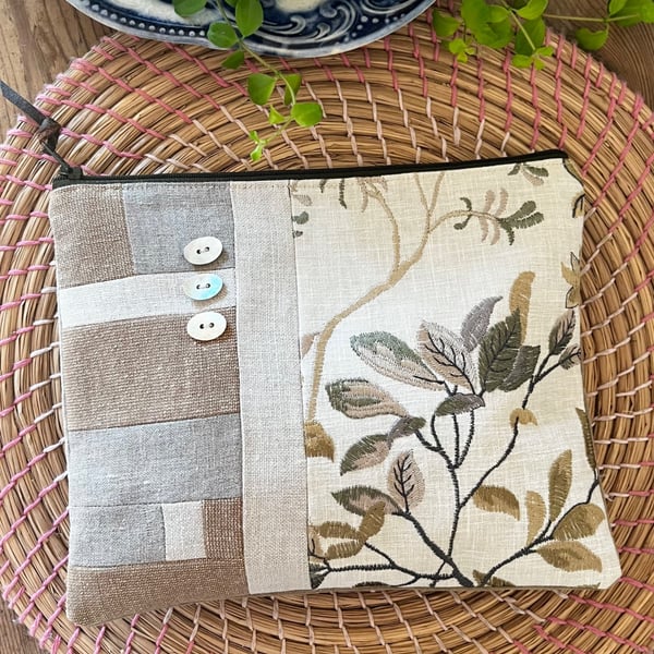 Linen and velvet zip pouch with shell buttons and embroidery