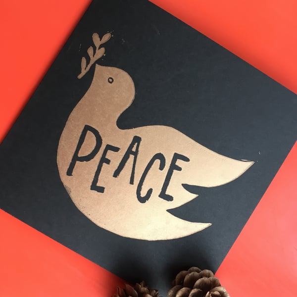 Hand printed bronze linoprint peace dove Christmas card