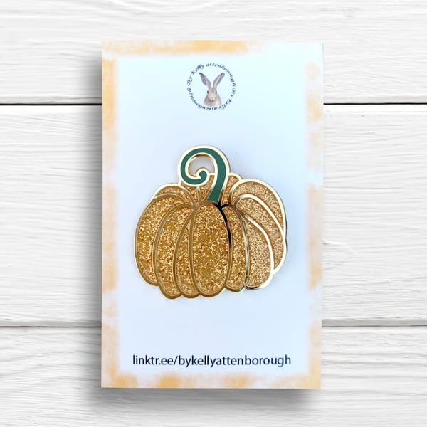 A fairytale pumpkin pin badge