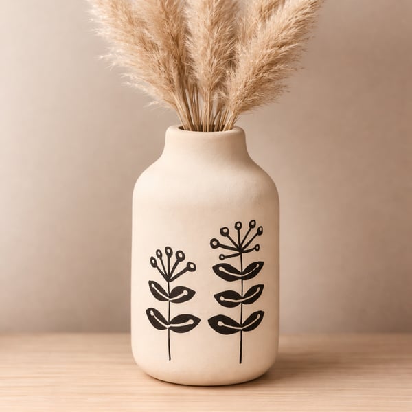 Mini vase with hand drawn flowers. 