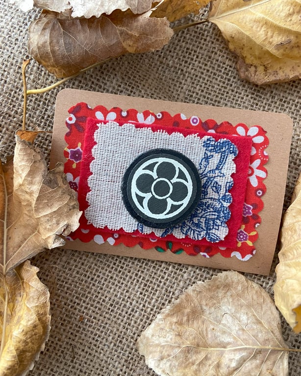 Medieval style wooden brooch with black quadrafoil pattern