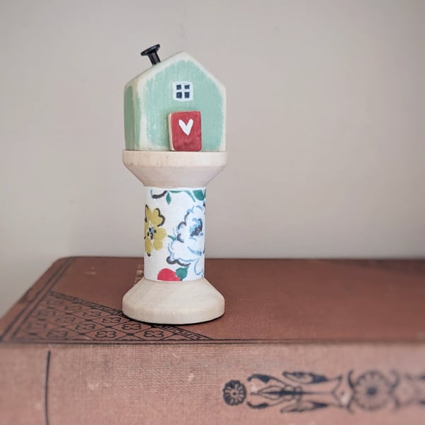 Little Wooden House on a Floral Wooden Bobbin 