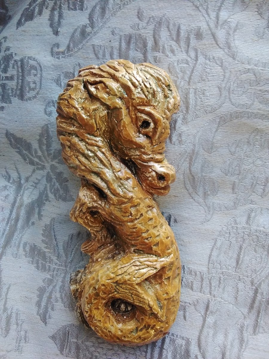 Seahorse Carving in Ochre and Gold.