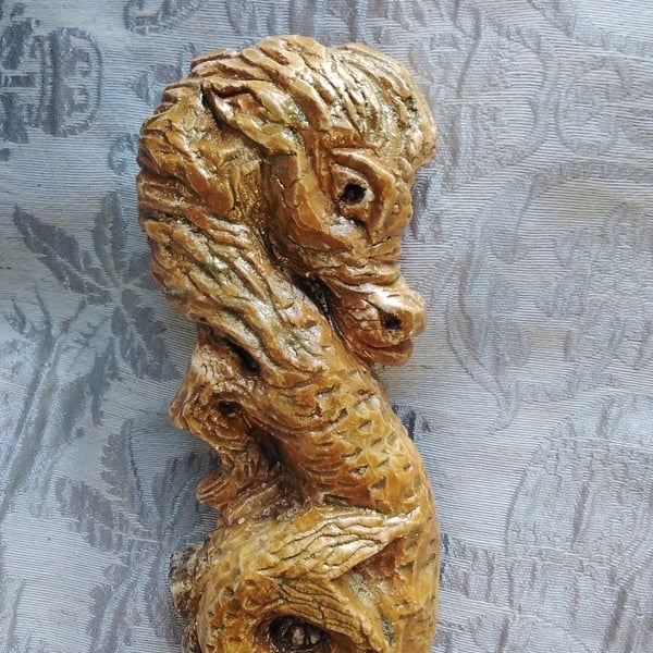 Seahorse Carving in Ochre and Gold.