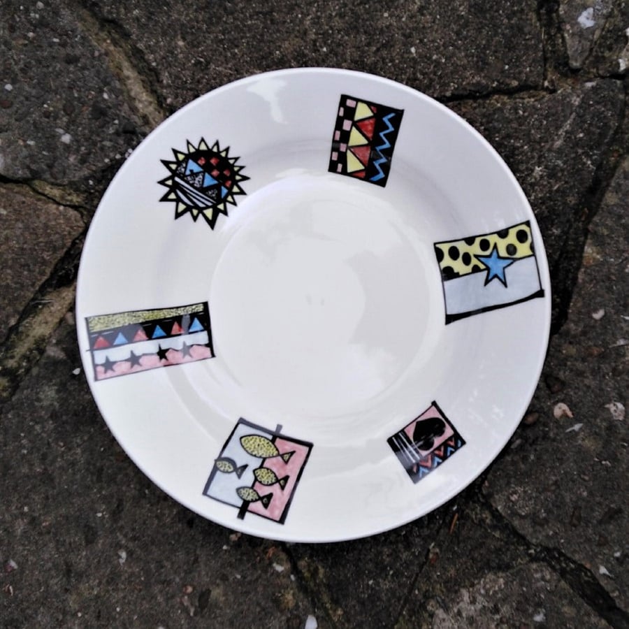 Pasta or soup dish in white china hand decorated with abstract panels.