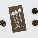 Brown Mushrooms – Small handmade lino print on coloured paper