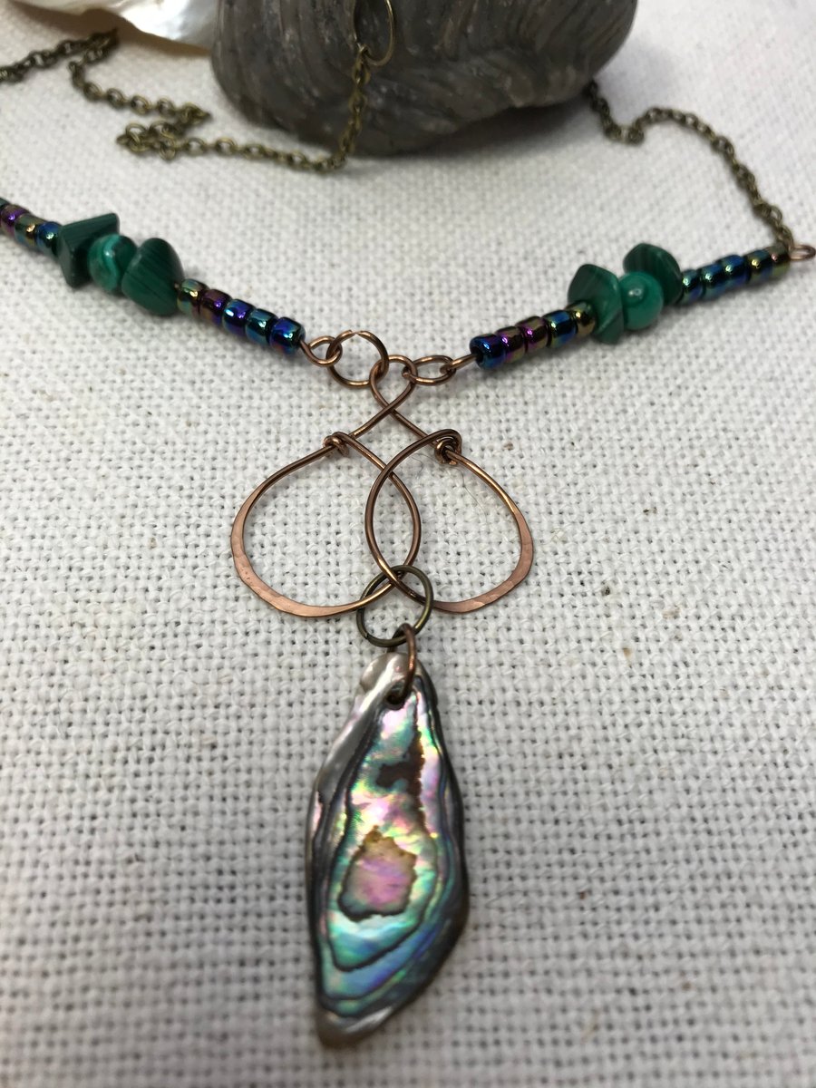 A handmade necklace pendant in antique bronze wirework Abalone shell & Malachite