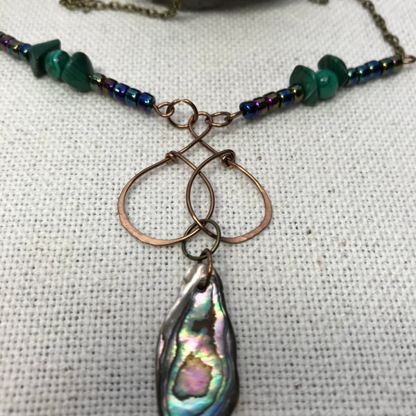 A handmade necklace pendant in antique bronze wirework Abalone shell & Malachite