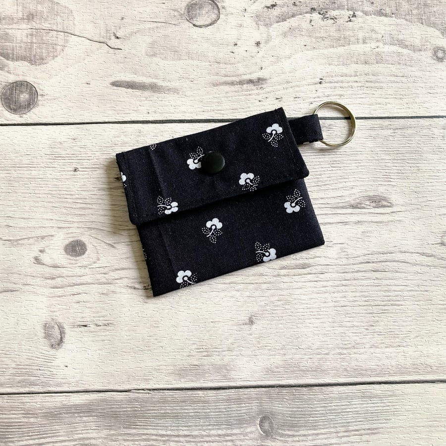 Lip balm keyring for round tins or long tubes. Black and white floral keychain.