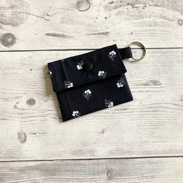 Lip balm keyring for round tins or long tubes. Black and white floral keychain.