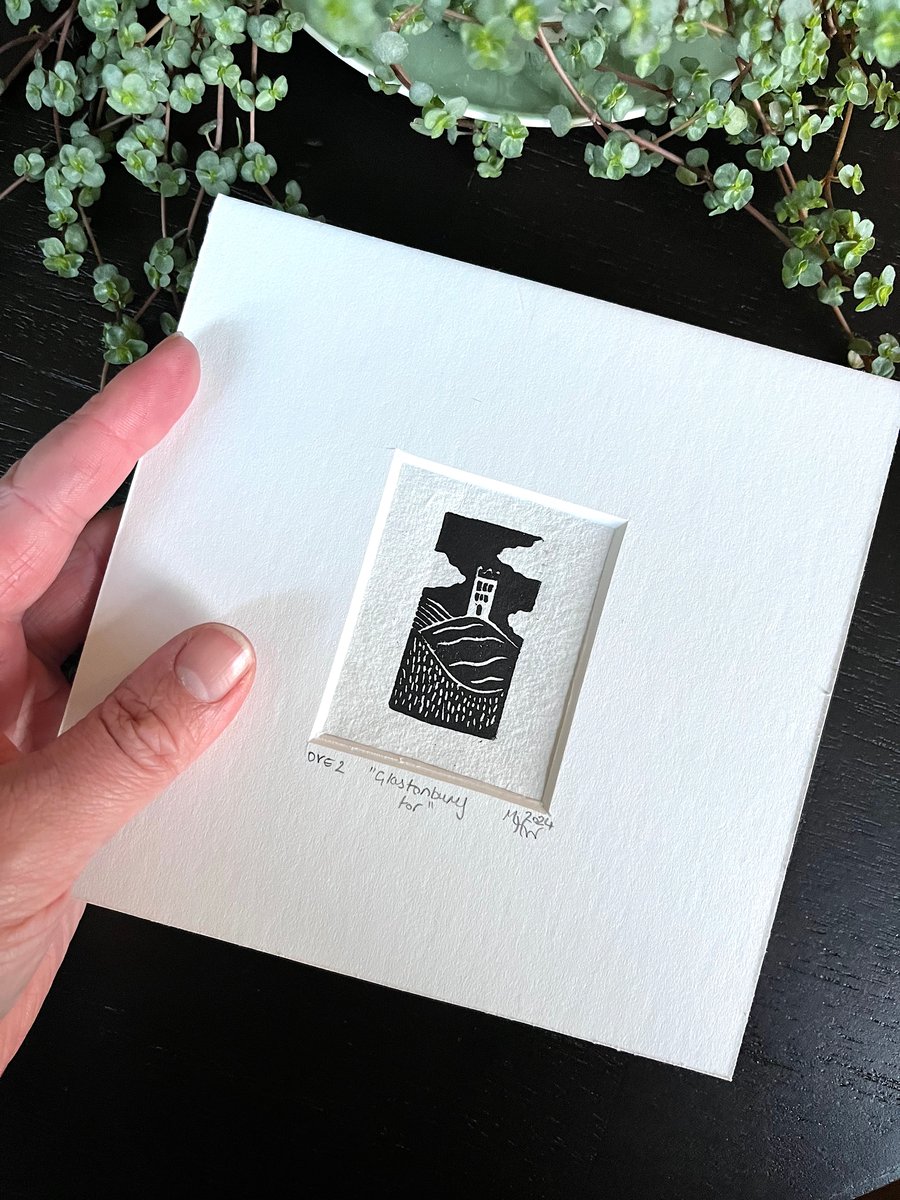 Mounted mini lino print of a popular monument entitled "Glastonbury Tor", second