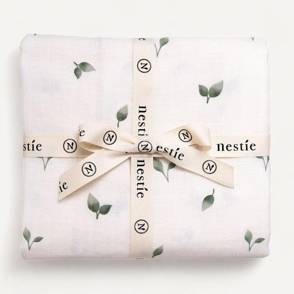 Two Layer Muslin Baby Blanket and Swaddle in our delicate Nestie Allotment Theme