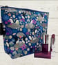 Makeup bags puffins on rocks 